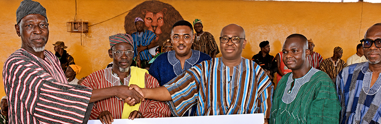 Kwamina Asomaning, Chief Executive Officer, Stanbic Bank Ghana, presenting the cheque to representatives of the Yaa Naa.